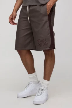 Bermudas à taille élastiquée, coupe décontractée, longueur longue et broderie
