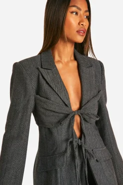Blazer cintré à devant noué en chevron