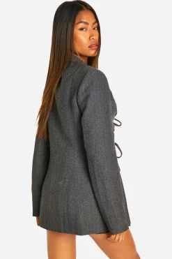 Blazer cintré à devant noué en chevron