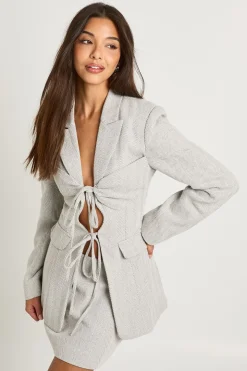 Blazer cintré à nouer en motif chevron