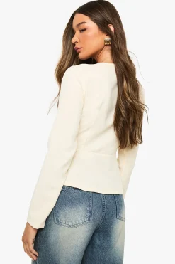 Blazer à peplum à boutons dorés
