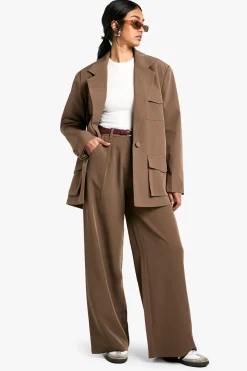Blazer surdimensionné à détails de poches tissées sur mesure
