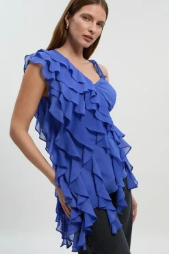 Blouse asymétrique en mousseline avec détails à volants
