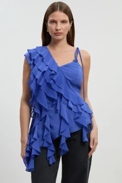 Blouse asymétrique en mousseline avec détails à volants