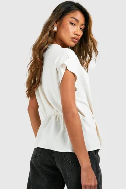 Blouse à col drapé à noeud frontal martelé