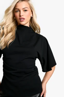 Blouse en crêpe jersey à col haut et manches évasées