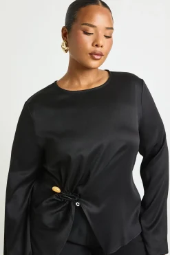 Blouse à manches évasées avec détails de garniture dorée