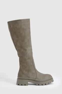 Botte à genou à coupe large et à semelle cramponnée