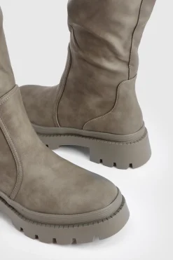 Botte à genou à coupe large et à semelle cramponnée