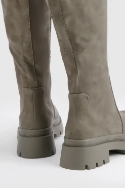 Botte à genou à coupe large et à semelle cramponnée