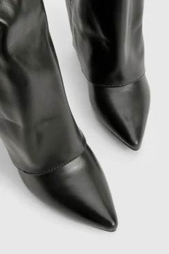 Bottes hautes jusqu'au genou avec détail de boucle et talon bloc repliable.