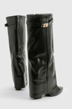 Bottes hautes jusqu'au genou avec détail de boucle et talon bloc repliable.