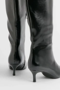 Bottes hautes jusqu'aux genoux à bout pointu et à talon bas en synthétique