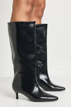 Bottes hautes jusqu'aux genoux à bout pointu et à talon bas en synthétique