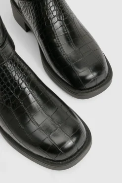 Bottes mi-hautes à orteil carré massif avec détails de harnais