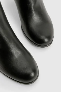 Bottes mi-hautes à talon bloc en cuir verni texturé