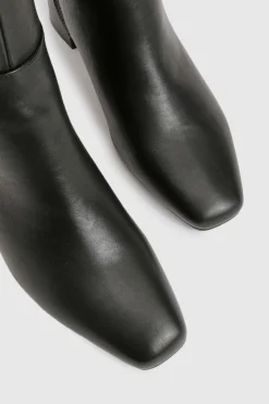Bottes montantes stretch à coupe large, évasées et à talon bloc