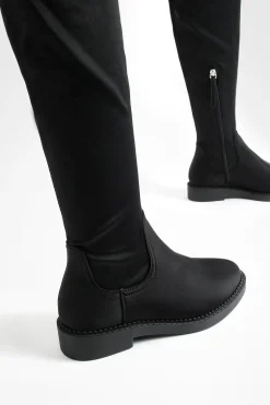 Bottes montantes stretch à coupe large et à talon plat