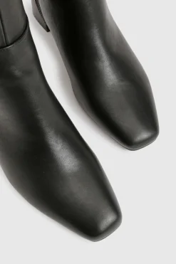 Bottes montantes stretch à talon évasé