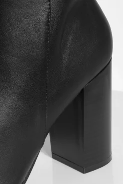 Bottes montantes à talons hauts