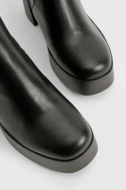 Bottes montantes à talon évasé