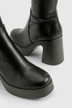 Bottes montantes à talon évasé