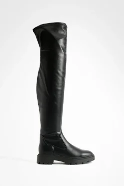Bottes plates massives au-dessus du genou