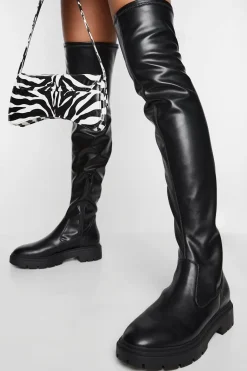 Bottes plates massives au-dessus du genou