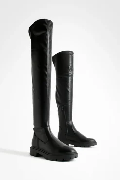 Bottes plates massives au-dessus du genou