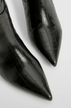 Bottes stiletto hautes jusqu'aux genoux courbées