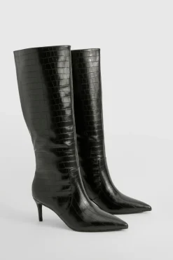 Bottes stiletto hautes jusqu'aux genoux courbées