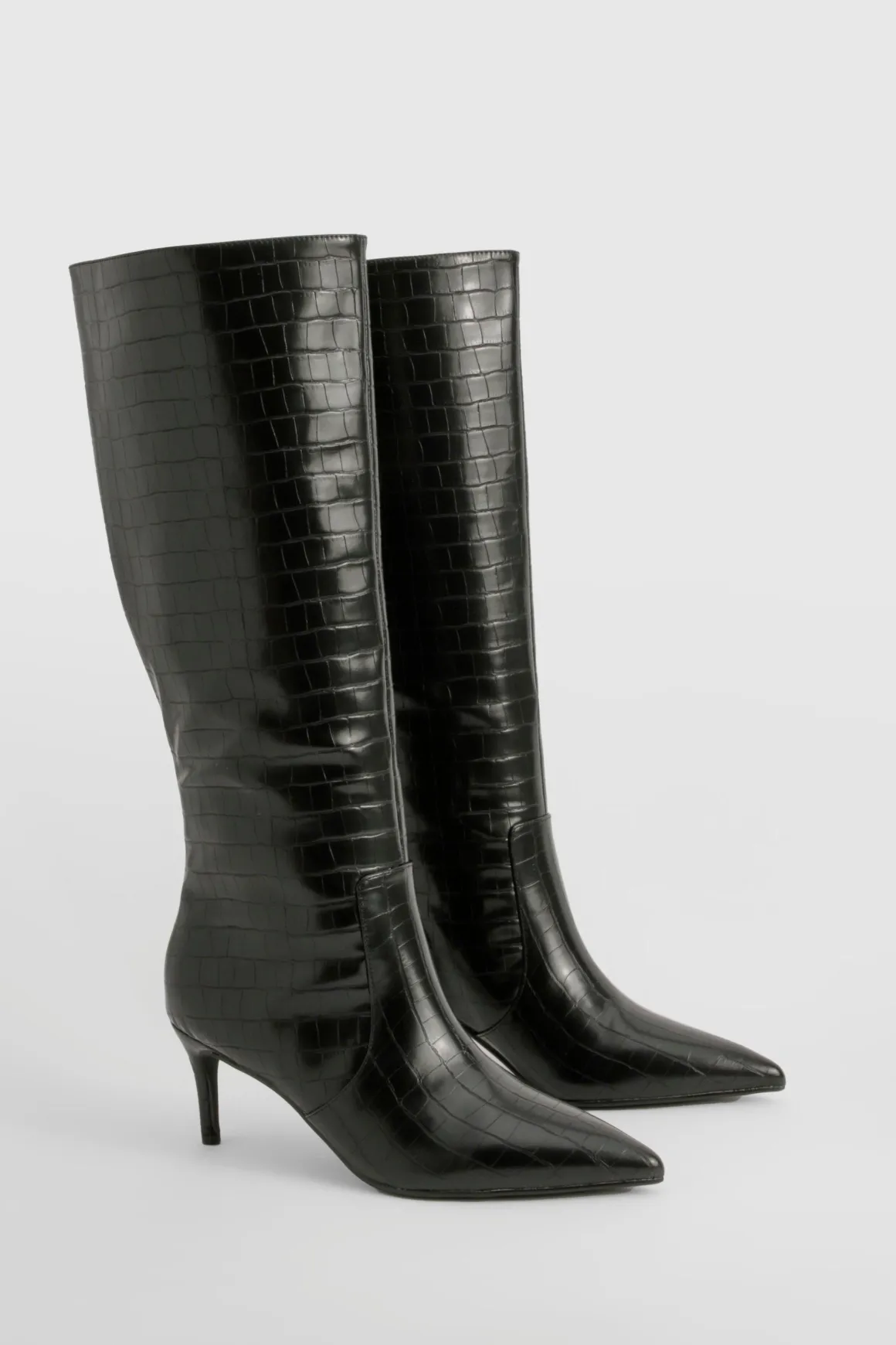 Bottes stiletto hautes jusqu'aux genoux courbées