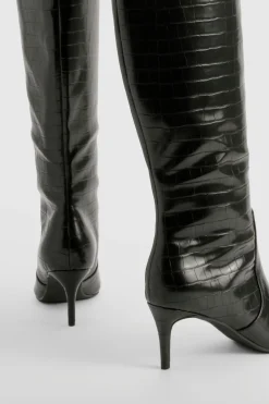 Bottes stiletto hautes jusqu'aux genoux courbées