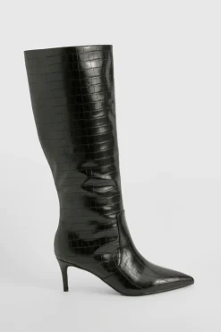 Bottes stiletto hautes jusqu'aux genoux courbées