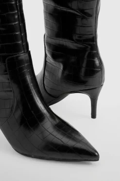 Bottes stiletto hautes jusqu'aux genoux courbées
