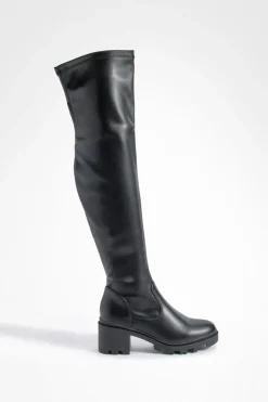 Bottes à talon bloc qui montent au-dessus du genou