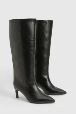 Bottes à talons hauts montantes jusqu'au genou, coupe large et bout pointu