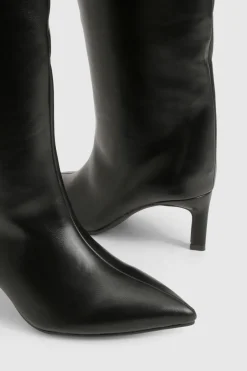 Bottes à talons hauts montantes jusqu'au genou, coupe large et bout pointu