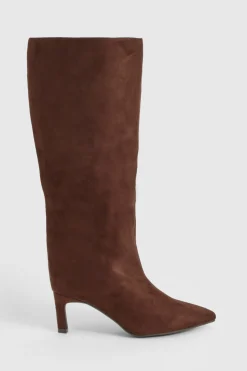 Bottes à talons hauts montantes jusqu'au genou, bout pointu et coupe large