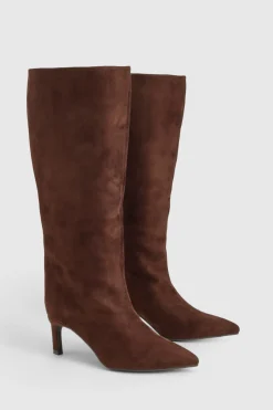 Bottes à talons hauts montantes jusqu'au genou, bout pointu et coupe large