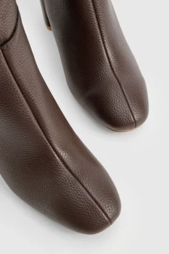 Bottes à talon texturées arrivant au genou