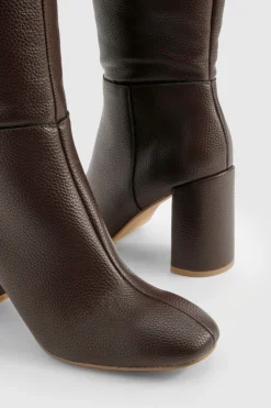 Bottes à talon texturées arrivant au genou