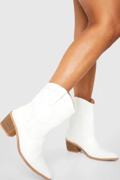 Bottes western à cheville, coupe large et détails de surpiqûres
