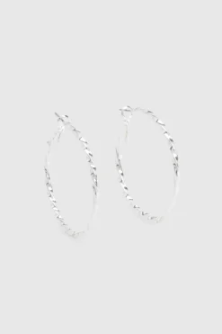 Boucles d'oreilles créoles larges ornées d'argent