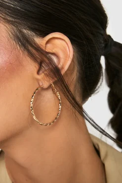 Boucles d'oreilles créoles torsadées en or