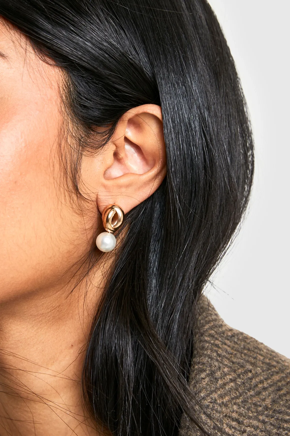 Boucles d'oreilles pendantes perle à torsade dorées