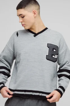 Boxy Pull Varsity Effet usé à encolure en V