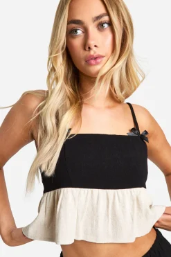 Camisole peplum à l'aspect lin avec nœud contrasté