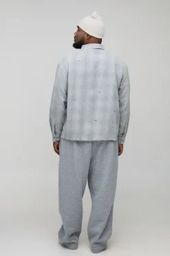 Chemise à carreaux en flanelle surdimensionnée à l'effet vieilli avec détails de quincaillerie
