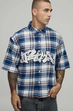 Chemise À Carreaux Imprimé Graffiti Demi-manches Coupe Ample Oversize